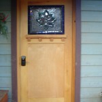 Arts & Crafts Door The arts and crafts door is made of oak from Pollock Pines CA, the dental under the stained glass is burl. The door nob is key-less entry.