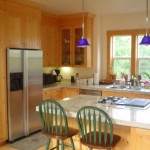 The sugar pine in this kitchen came from the property that the house was built on. It was milled, air dried then used to make the kitchen and window trim. I like the extra counter top depth behind the sink. The crown molding is custom made as well.