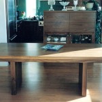 Walnut Table This walnut slab table compliments the walnut kitchen, it is designed to add two 18 in. leafs at the ends of the table.